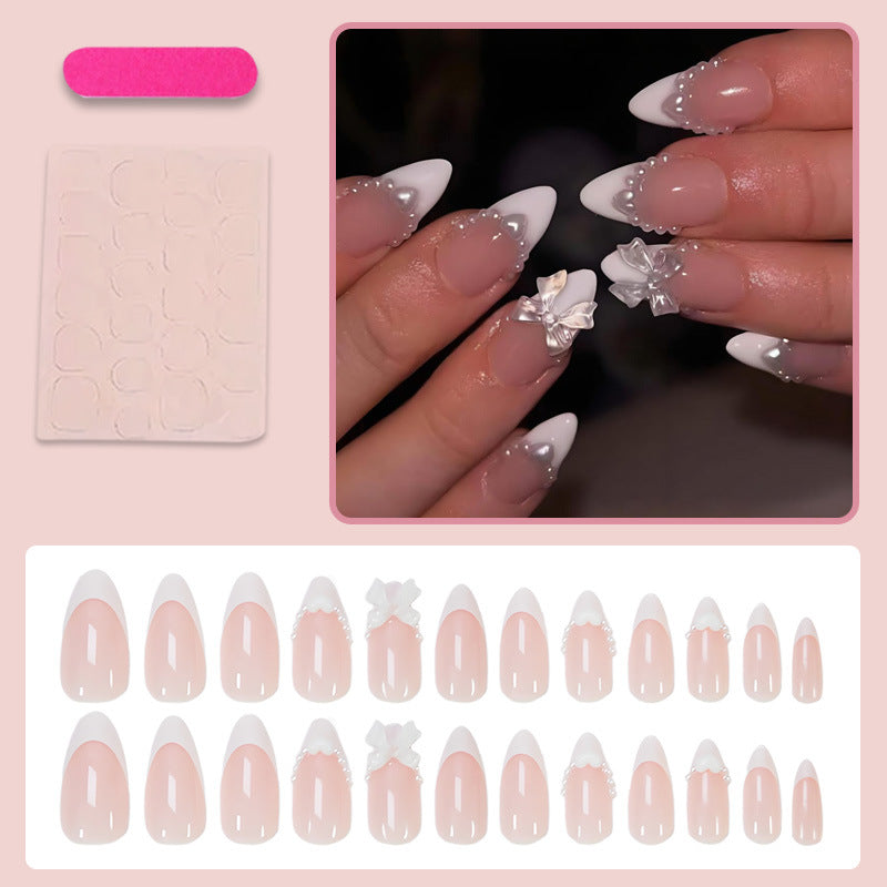 Artificial nail set with elegant tips and playful bow details Kalsten