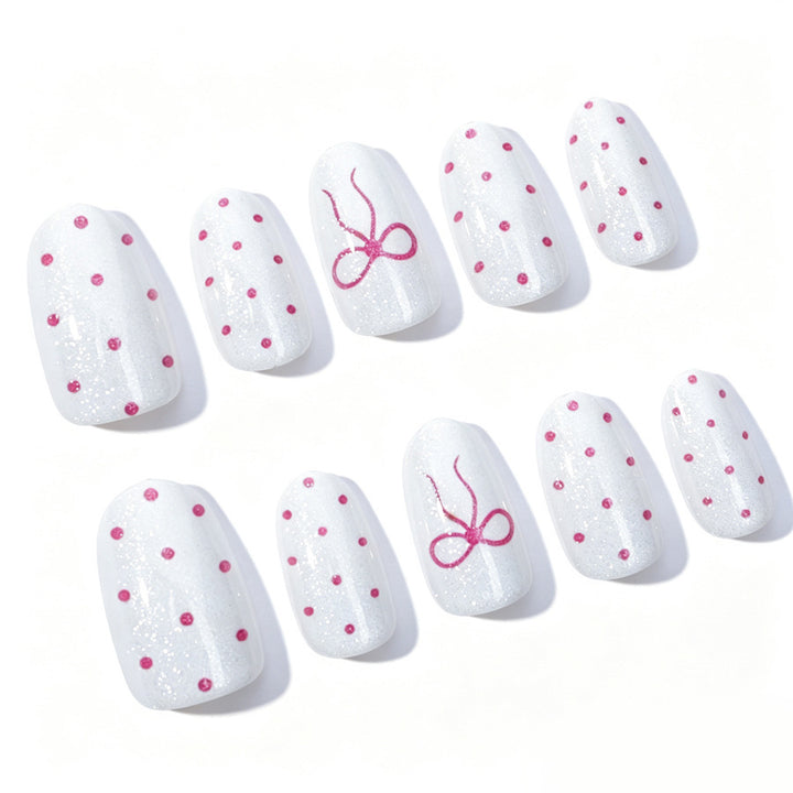 Artificial nail set with delicate dots and bow pattern Kalsten