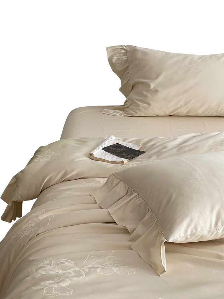 Bedding set made of cotton satin with ruffle, subtle jacquard floral relief and silky-matt finish