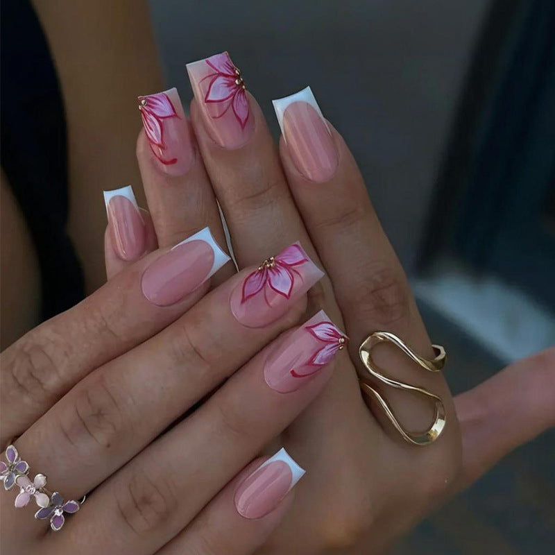 Artificial nail set with elegant flower designs and glitter accents Kalsten