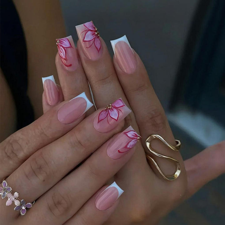 Artificial nail set with elegant flower designs and glitter accents Kalsten