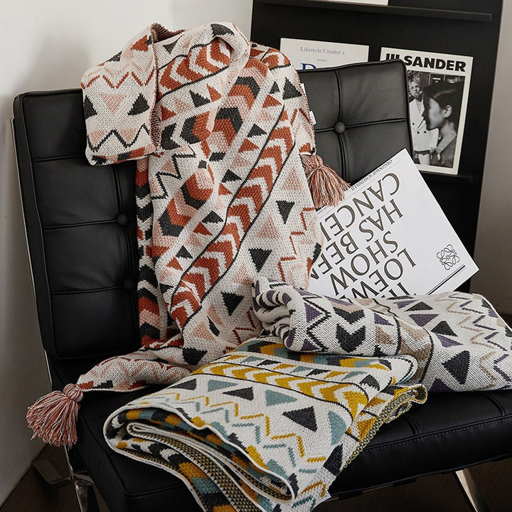 Patterned throw blanket in ethnic knit design with tassels