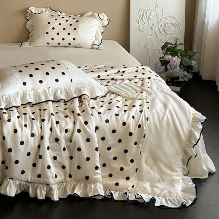 Elegant satin bedding set with polka dot pattern, ruffle and contrasting edge piping