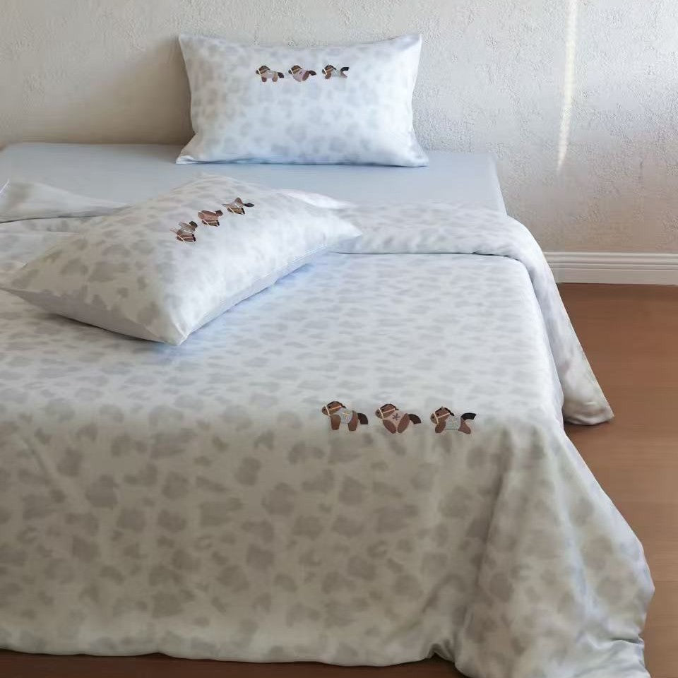 Bedding set with subtle leopard texture and embroidered horse motifs