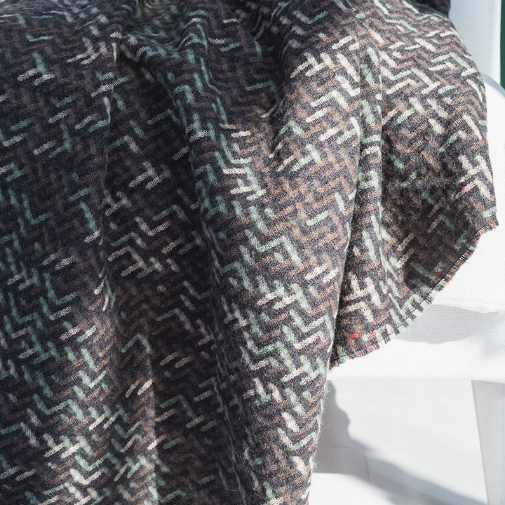 Coarsely woven throw blanket with herringbone jacquard and long fringes