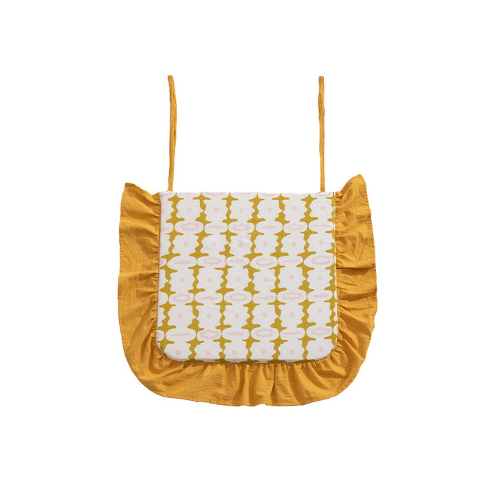 Padded chair seat cushion with tie straps and ruffled edge