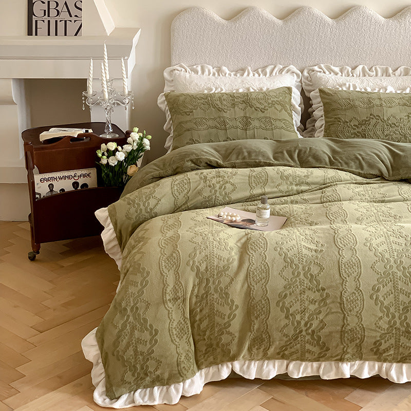 Quilted bedding set with ruffled hem and tone-on-tone embroidery