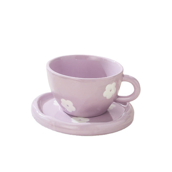 Large ceramic bowl as coffee and tea cup with matching saucer and decorative flower appliqués