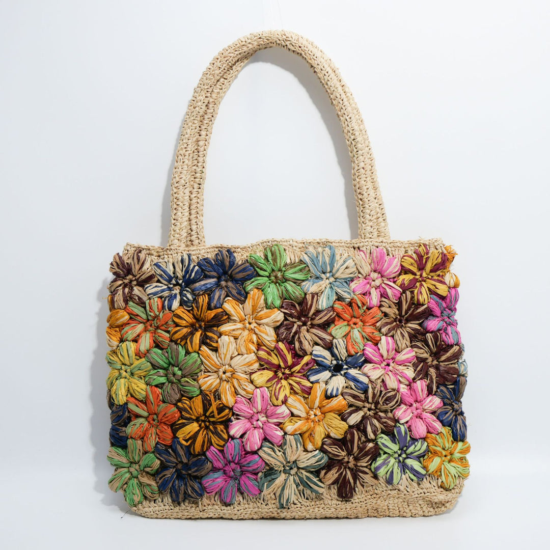 Handcrafted straw bag with floral appliqués Kalsten