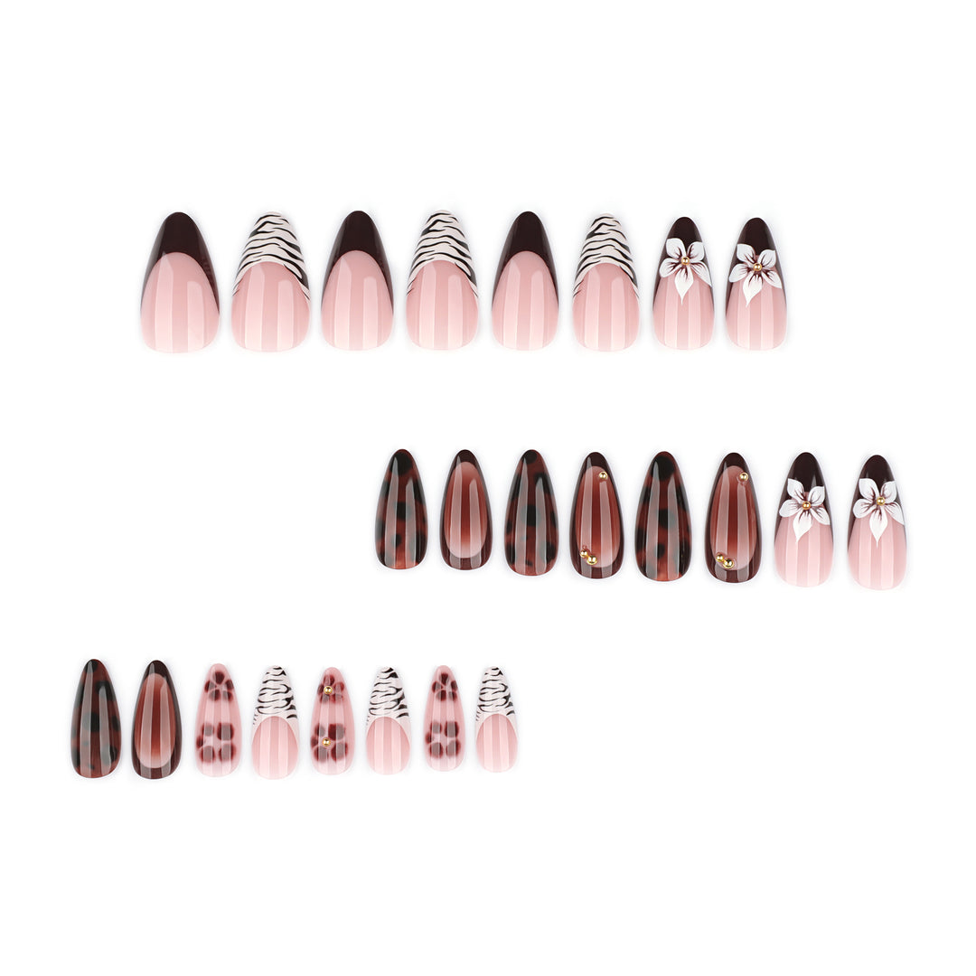 Artistic stiletto nails with elegant floral designs and glitter accents Kalsten