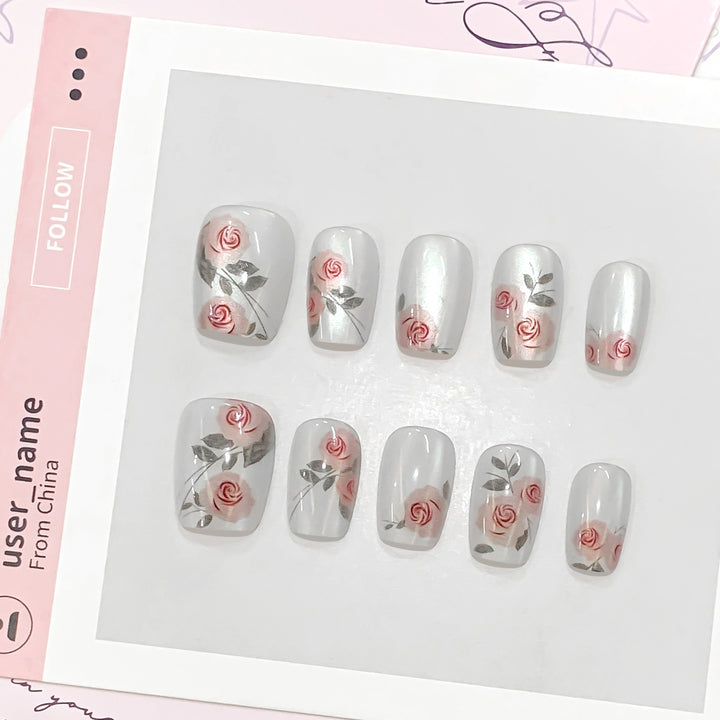 Artful nail extensions with rose designs Kalsten