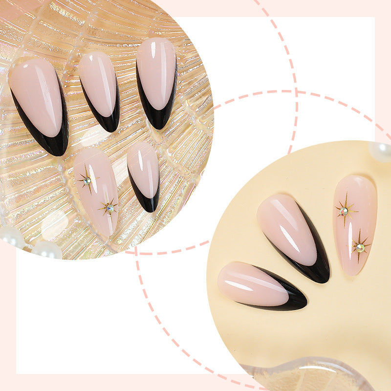 Acrylic nail set with elegant black accents and glamorous details Kalsten