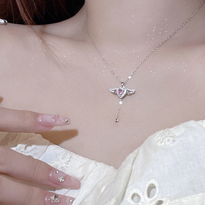 Playful angel neck chain with heart and wings Kalsten