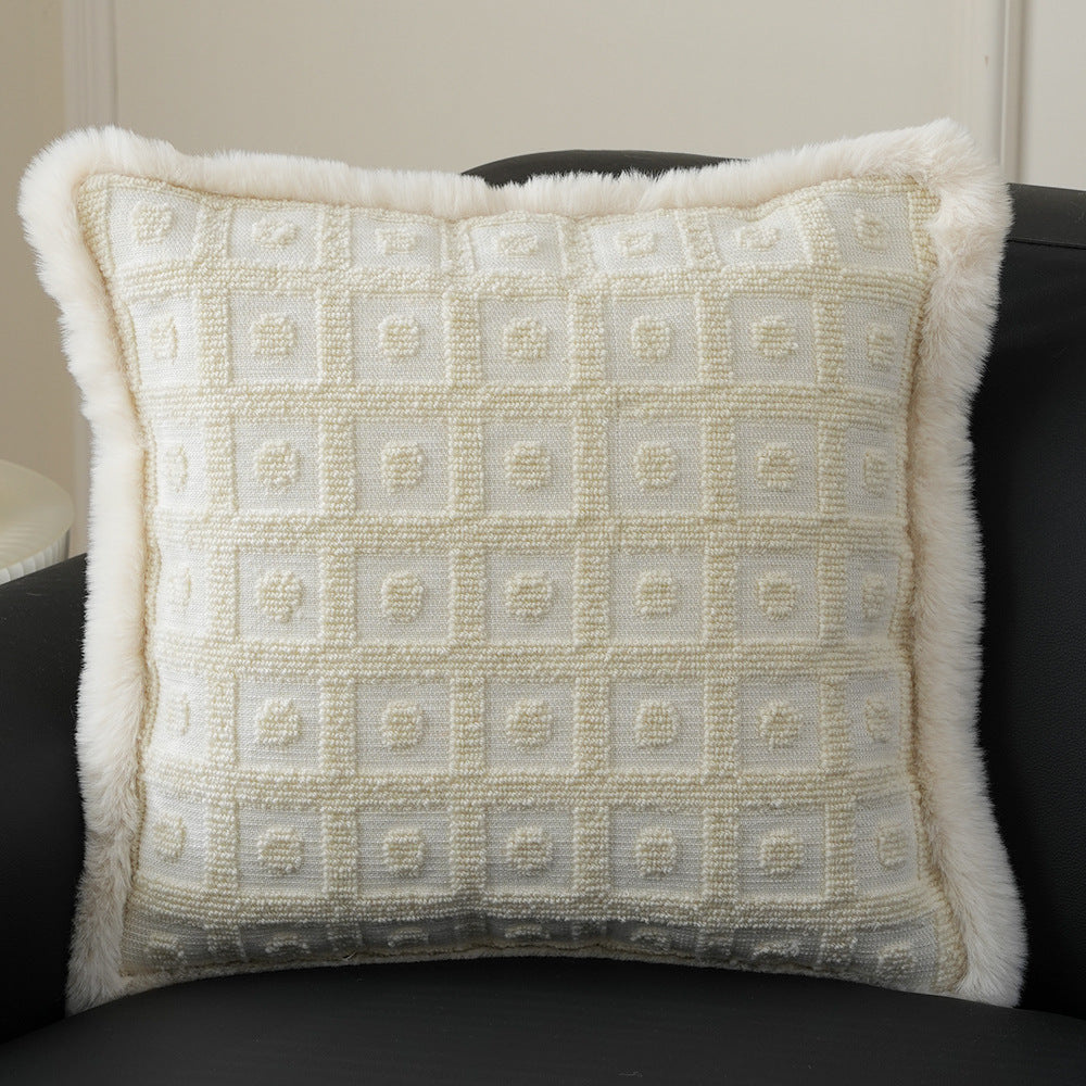 Square decorative pillow with embossed circular relief and soft faux fur edging