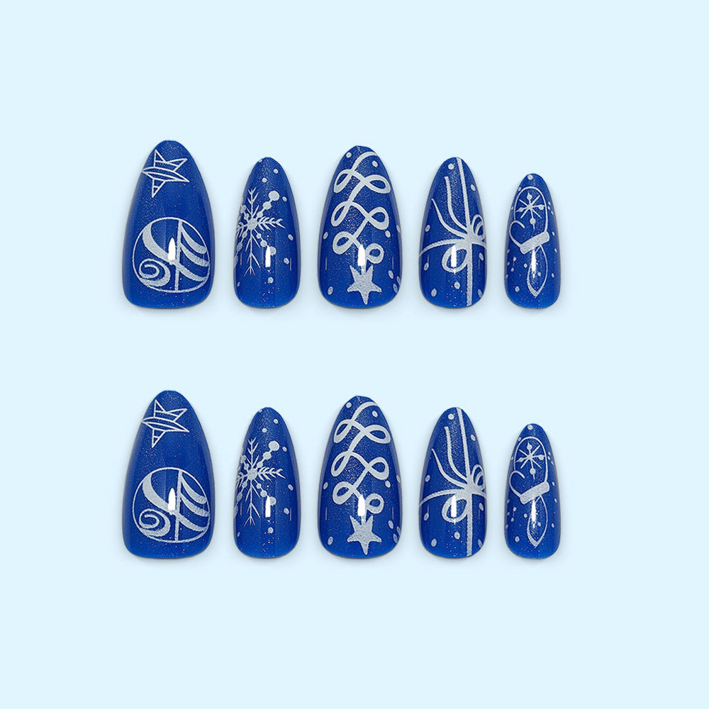 Artificial nails in festive winter design with glittering snowflakes and elegant decorations Kalsten