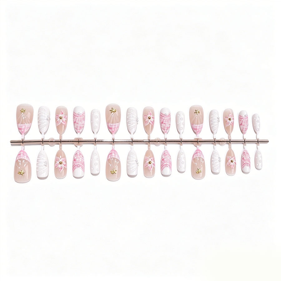 Art nail set with elegant floral decorations and glitter accents Kalsten