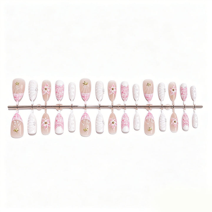 Art nail set with elegant floral decorations and glitter accents Kalsten