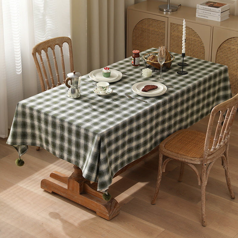 Square tablecloth made of cotton blend fabric with checkered weave pattern and pom-pom corners Kalsten