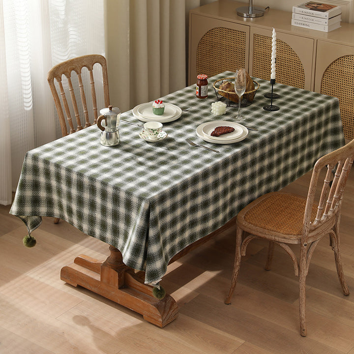 Square tablecloth made of cotton blend fabric with checkered weave pattern and pom-pom corners Kalsten