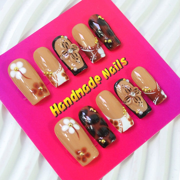 Acrylic nail set with elegant handcrafted designs and decorative accents Kalsten