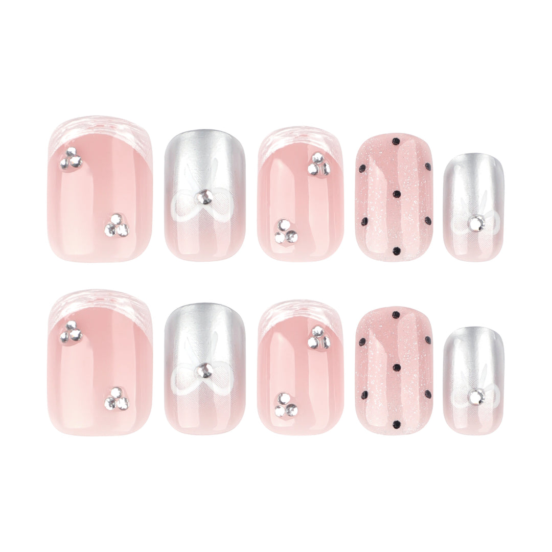 Artistic Nail Art with Bow and Glitter Accents Kalsten