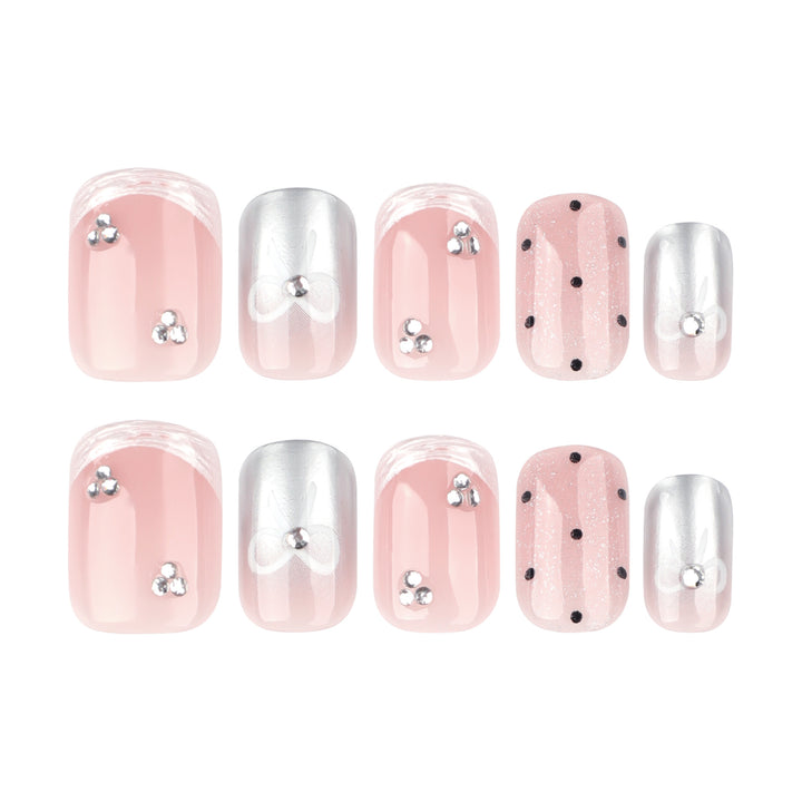 Artistic Nail Art with Bow and Glitter Accents Kalsten