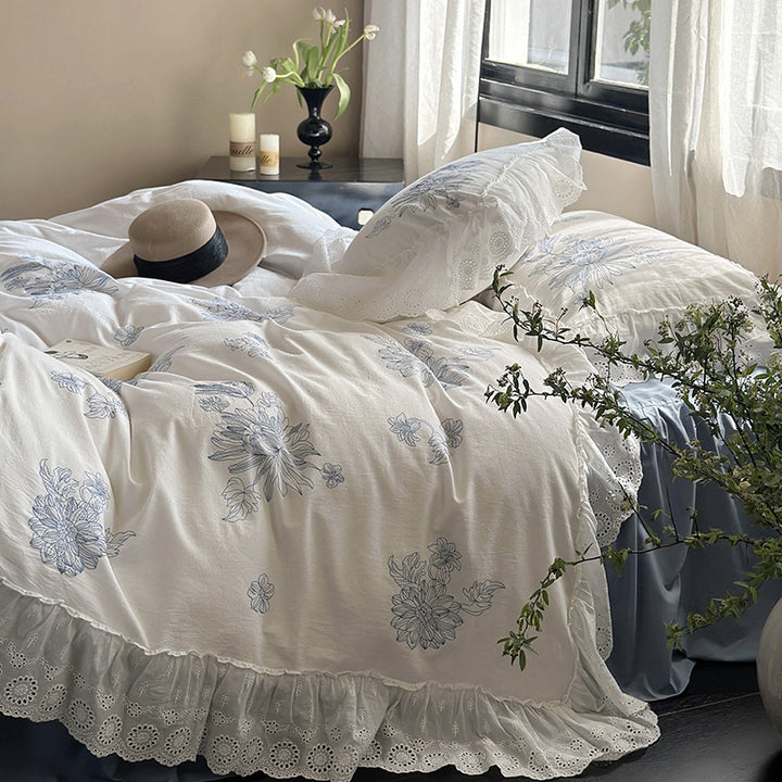 Embroidered bedding set in country house style with ruffled edging and eyelet lace