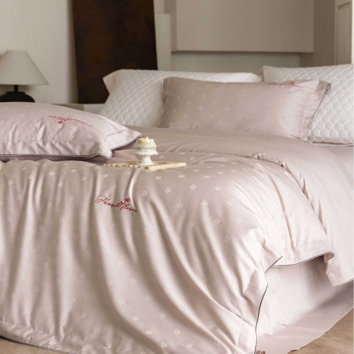 Luxurious satin bedding complete set with quilted cover and delicate logo embroidery