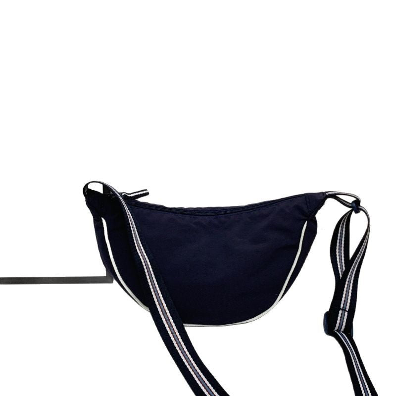 Fashionable shoulder bag with unique cut and adjustable strap Kalsten