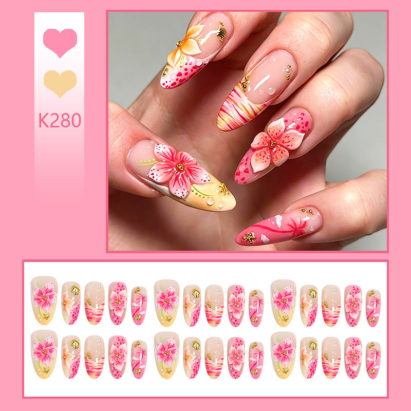 Artificial nails with floral embellishments and glitter accents Kalsten