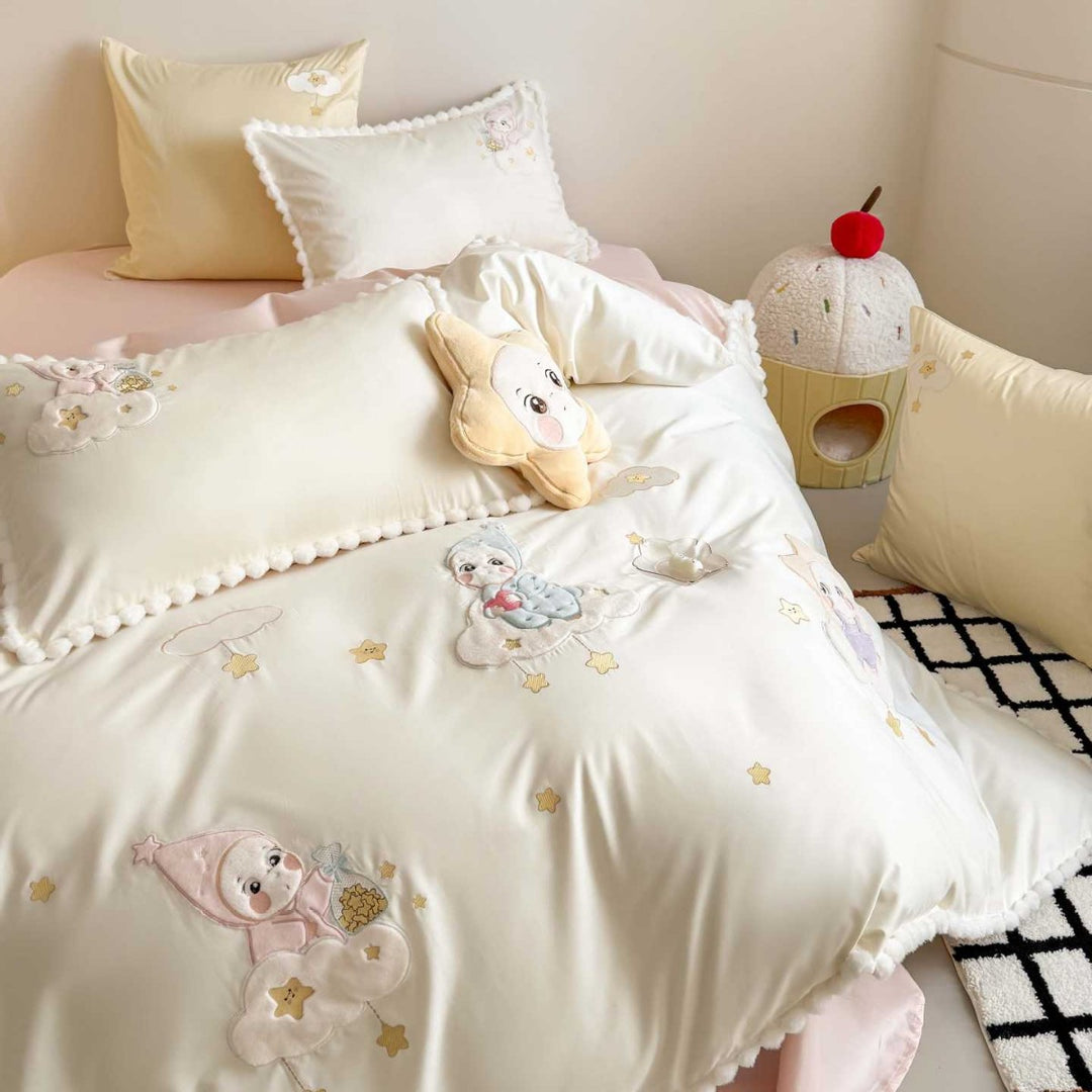 Bedding set for children with stitched cloud and star appliqués