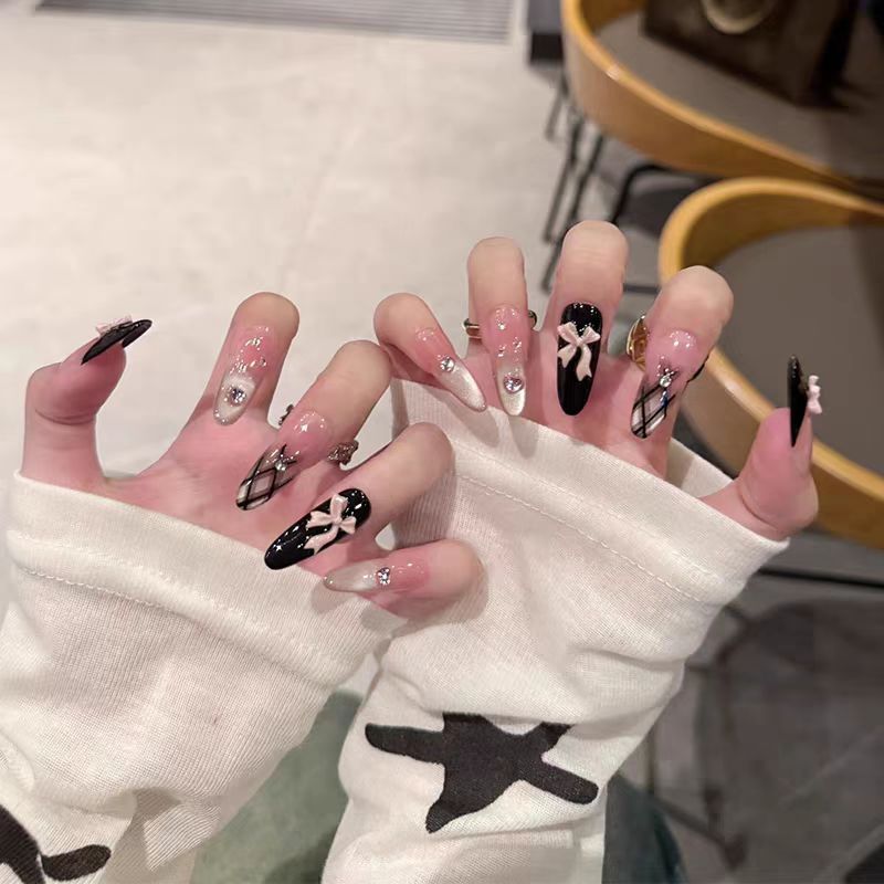 Decorative Press-On Nail Extensions with Bow and Rhinestone Accents Kalsten