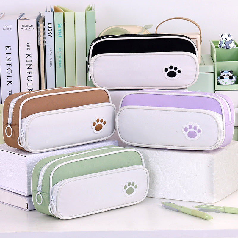 Pencil case with double compartment design and playful paw print motif Kalsten