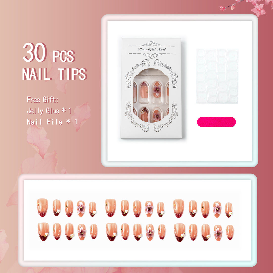 Artificial nail set with floral accents and gold embellishments Kalsten