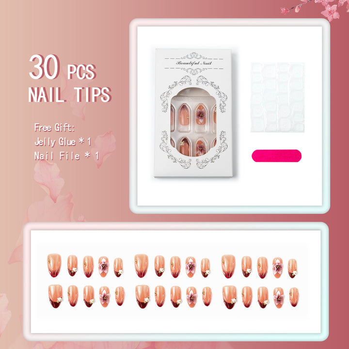 Artificial nail set with floral accents and gold embellishments Kalsten