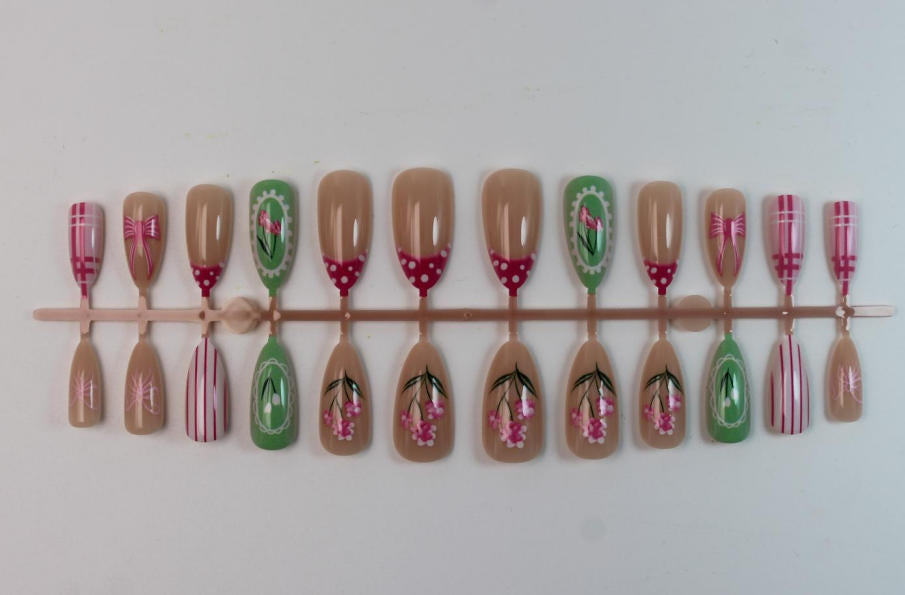 Acrylic nail set with floral and playful designs Kalsten