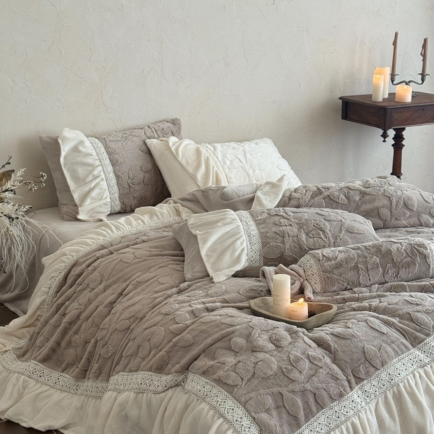 Romantic quilted bedding set with ruffle, floral relief, and neck roll
