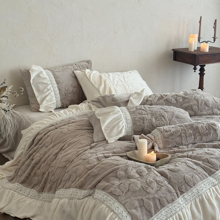 Romantic quilted bedding set with ruffle, floral relief, and neck roll