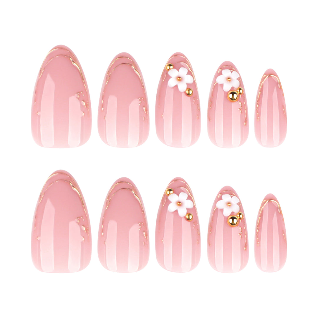 Artful nail design with golden accents and floral details Kalsten