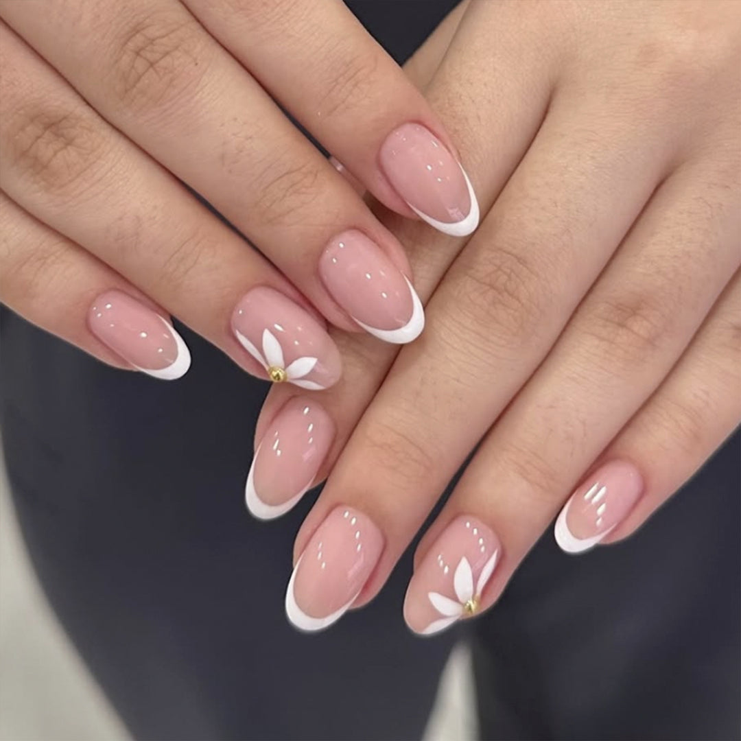 Artful French nails with delicate flowers and glitter accents Kalsten