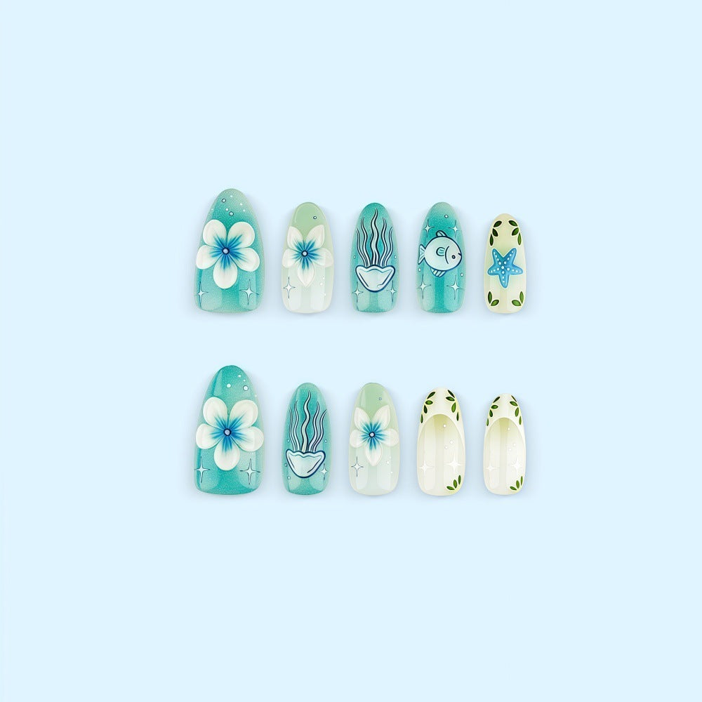 Artificial nails in a maritime design with colorful shell and water motifs Kalsten