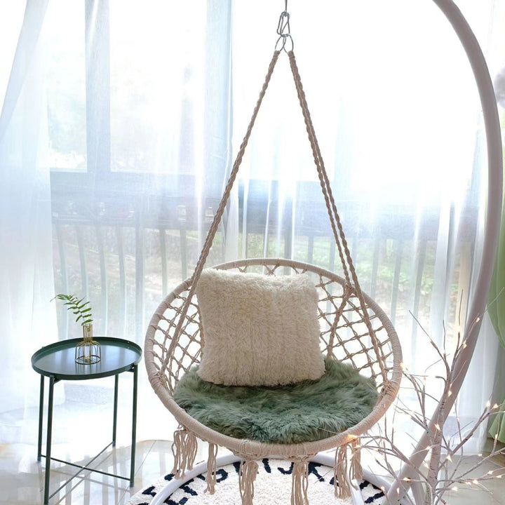 Boho macrame hanging swing chair with faux fur cushion and fringe Kalsten