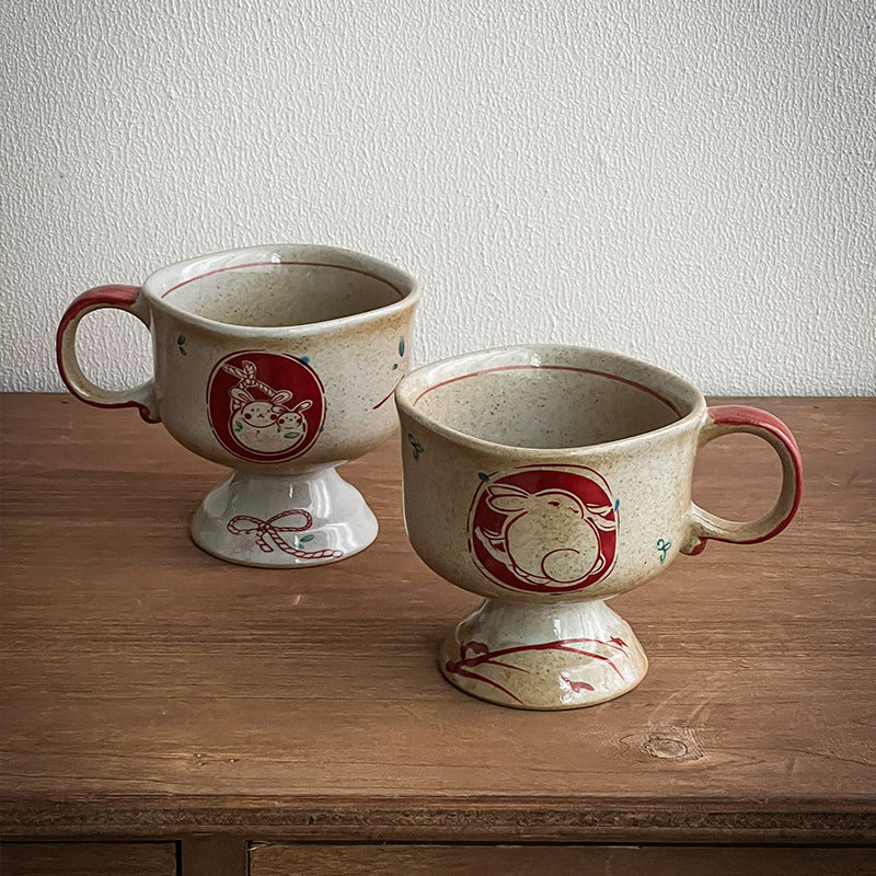 Ceramic foot mug with handle and hand-painted rabbit illustration