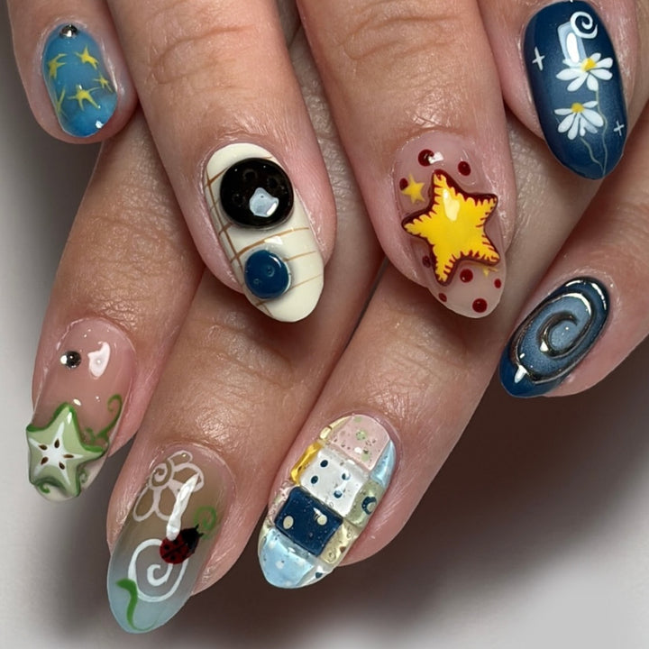 Artificial nails with creative maritime designs and 3D elements Kalsten