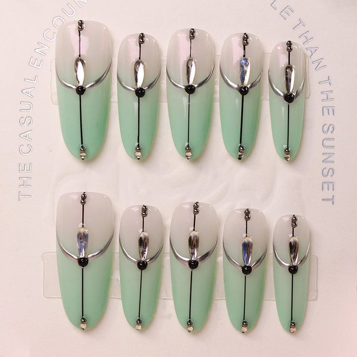 Acrylic nail set with elegant ombre effect and glamorous embellishments Kalsten