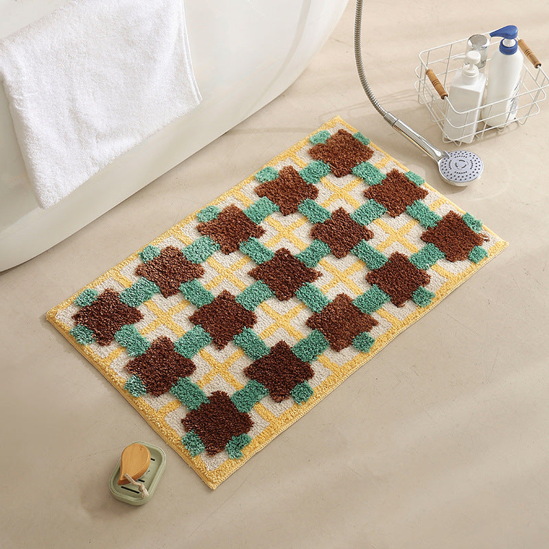 Hand-tufted bathroom bath mat with non-slip backing and textured square relief Kalsten