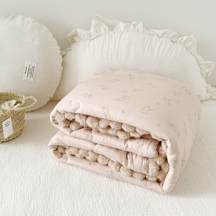 Cuddle blanket baby quilt with plush lining and bunny motif
