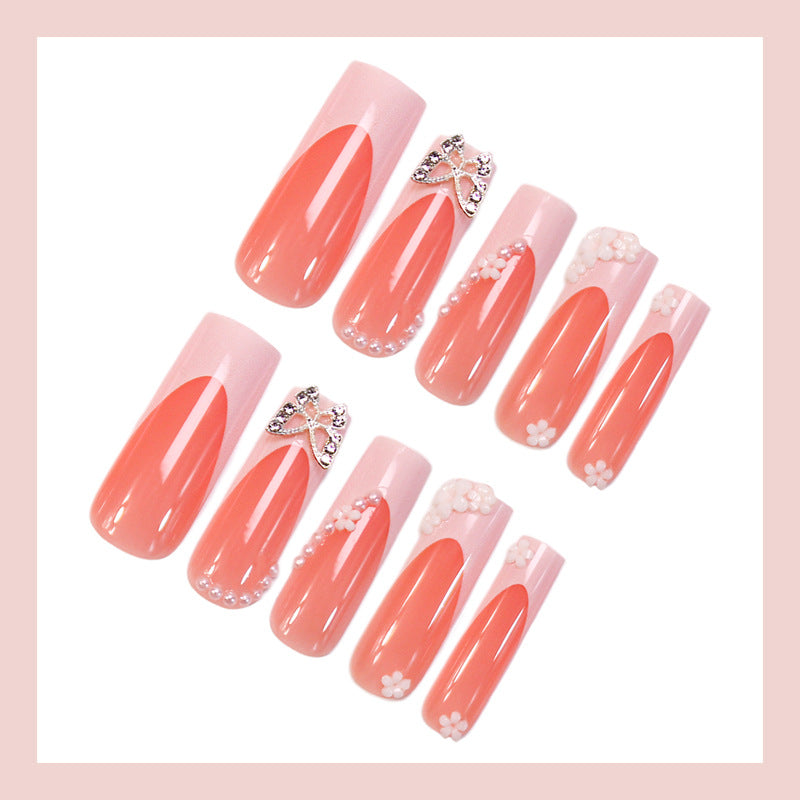 Artificial nail set with elegant floral decorations and glitter accents Kalsten