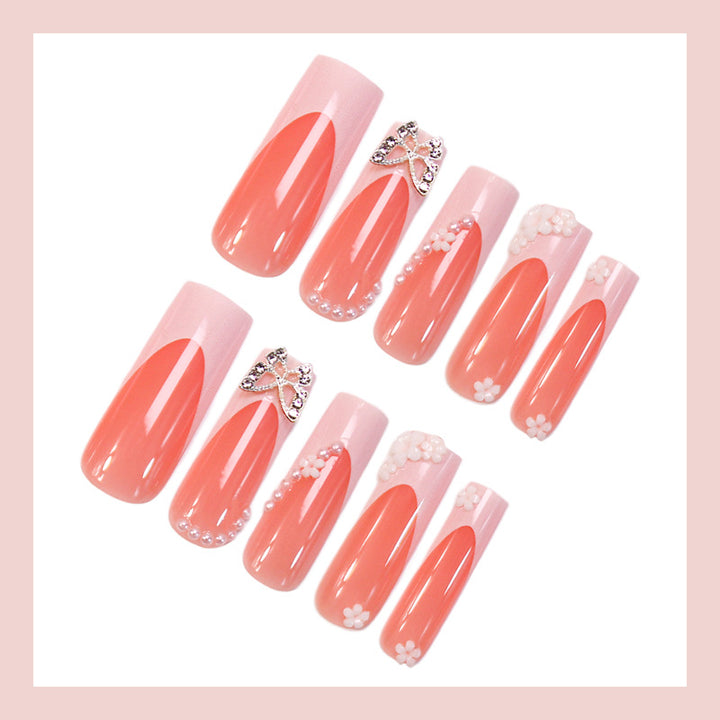 Artificial nail set with elegant floral decorations and glitter accents Kalsten