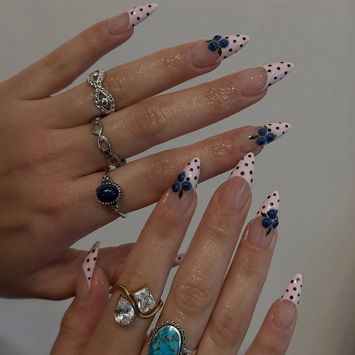 Acrylic nail set with stylish dots and floral embellishments Kalsten